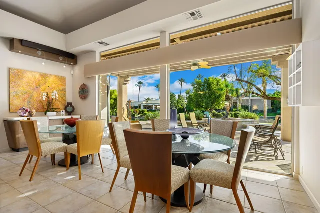 a view of house with outdoor space and swimming pool