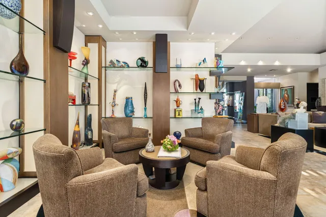 a view of an chairs and table in patio