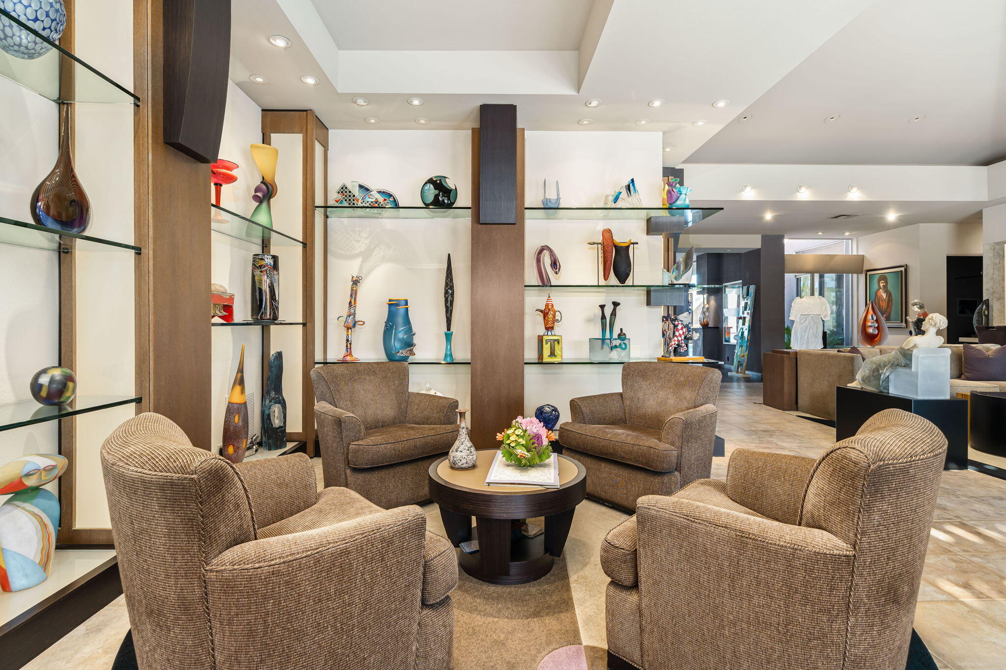206 Crystal Bay Court Rancho Mirage, CA 92270 - Photo 25 of 62 a living room with furniture white walls and a view of kitchen