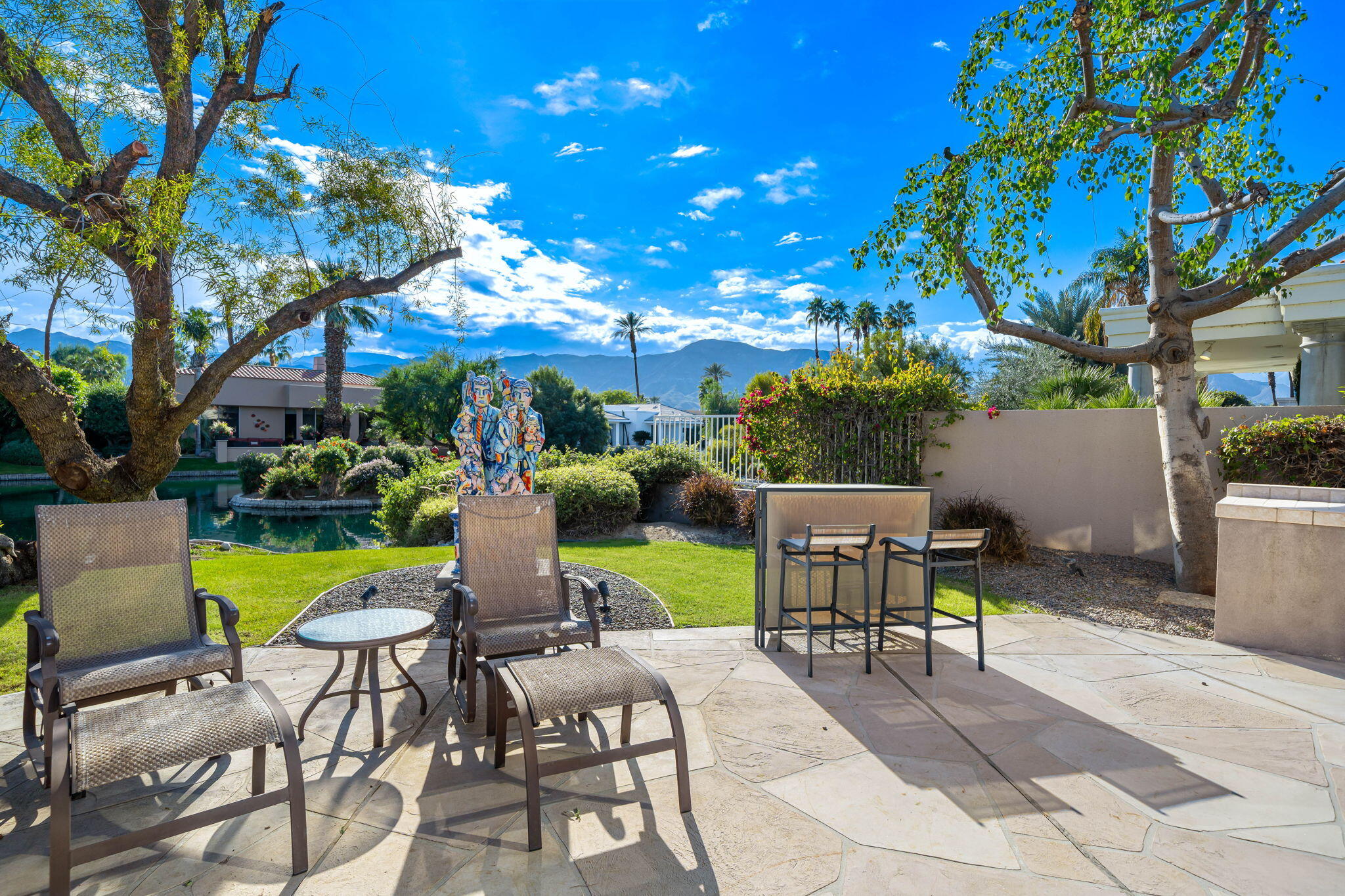 206 Crystal Bay Court Rancho Mirage, CA 92270 - Photo 34 of 62 a view of an chairs and table in patio