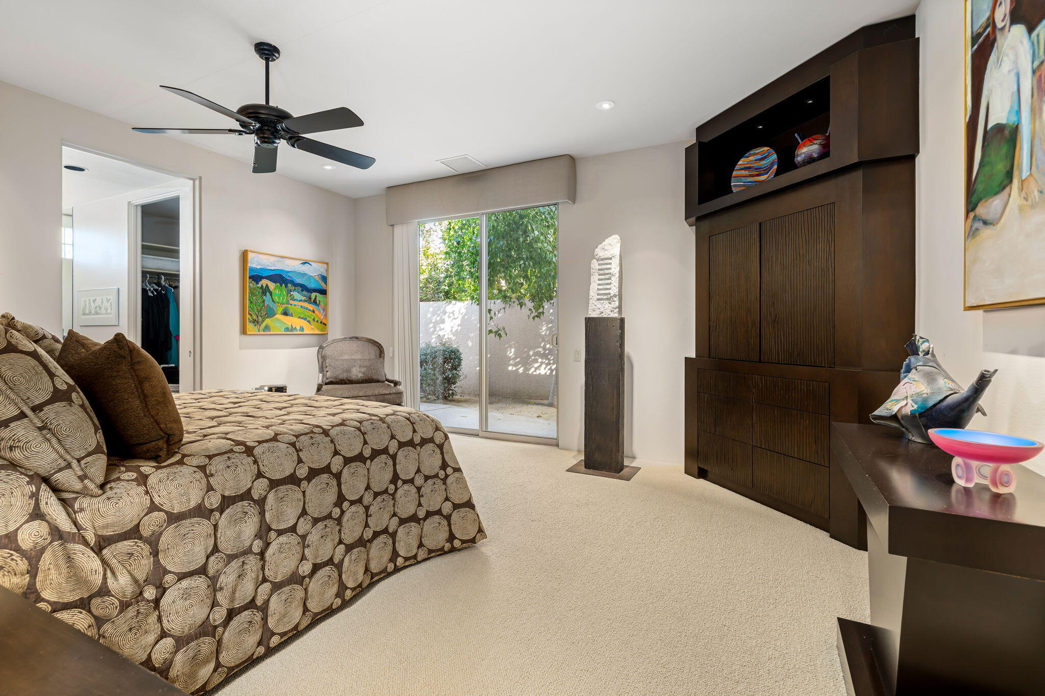 206 Crystal Bay Court Rancho Mirage, CA 92270 - Photo 37 of 62 a bedroom with a bed and a chandelier