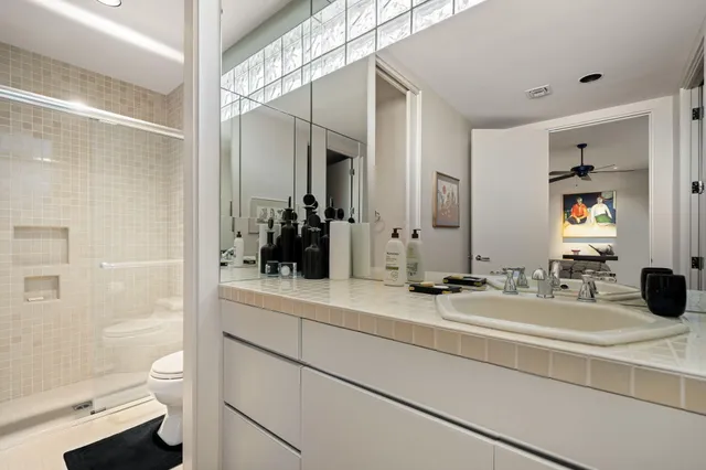 a kitchen with a sink cabinets and window