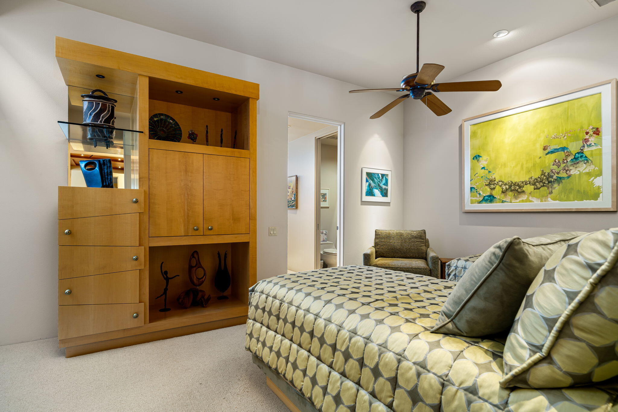 206 Crystal Bay Court Rancho Mirage, CA 92270 - Photo 40 of 62 a bedroom with a bed and a chandelier