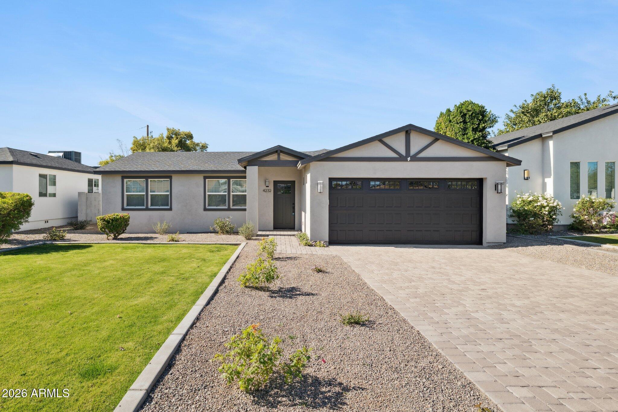 4232 North 19th Place Phoenix, AZ 85016 - Photo 1 of 39 a front view of a house with a yard and garage