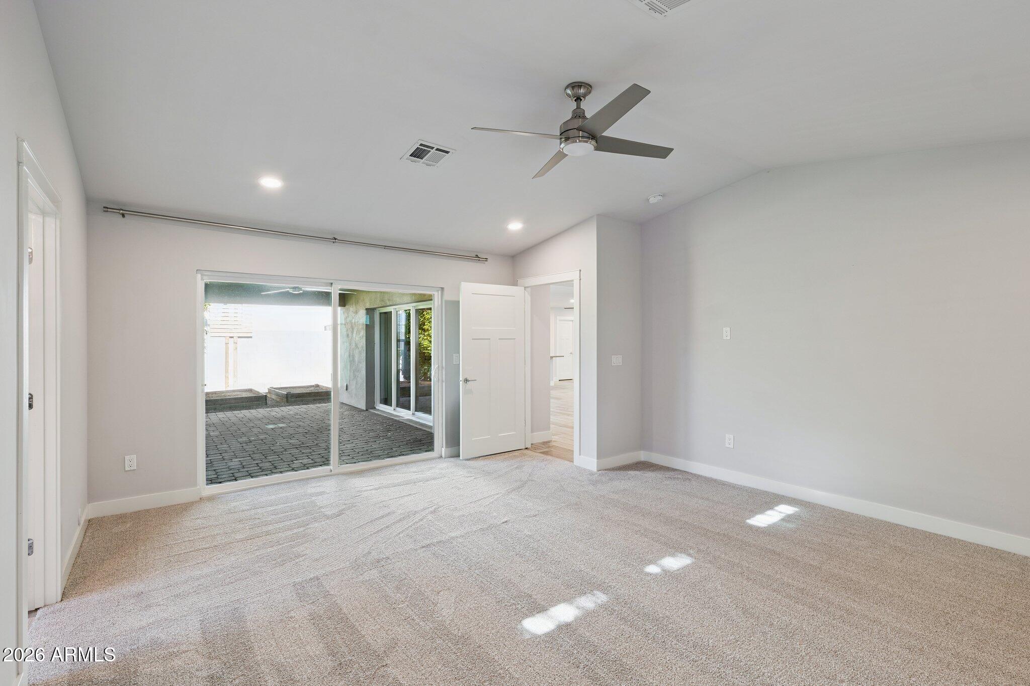 4232 North 19th Place Phoenix, AZ 85016 - Photo 16 of 39 a view of an empty room and a ceiling fan