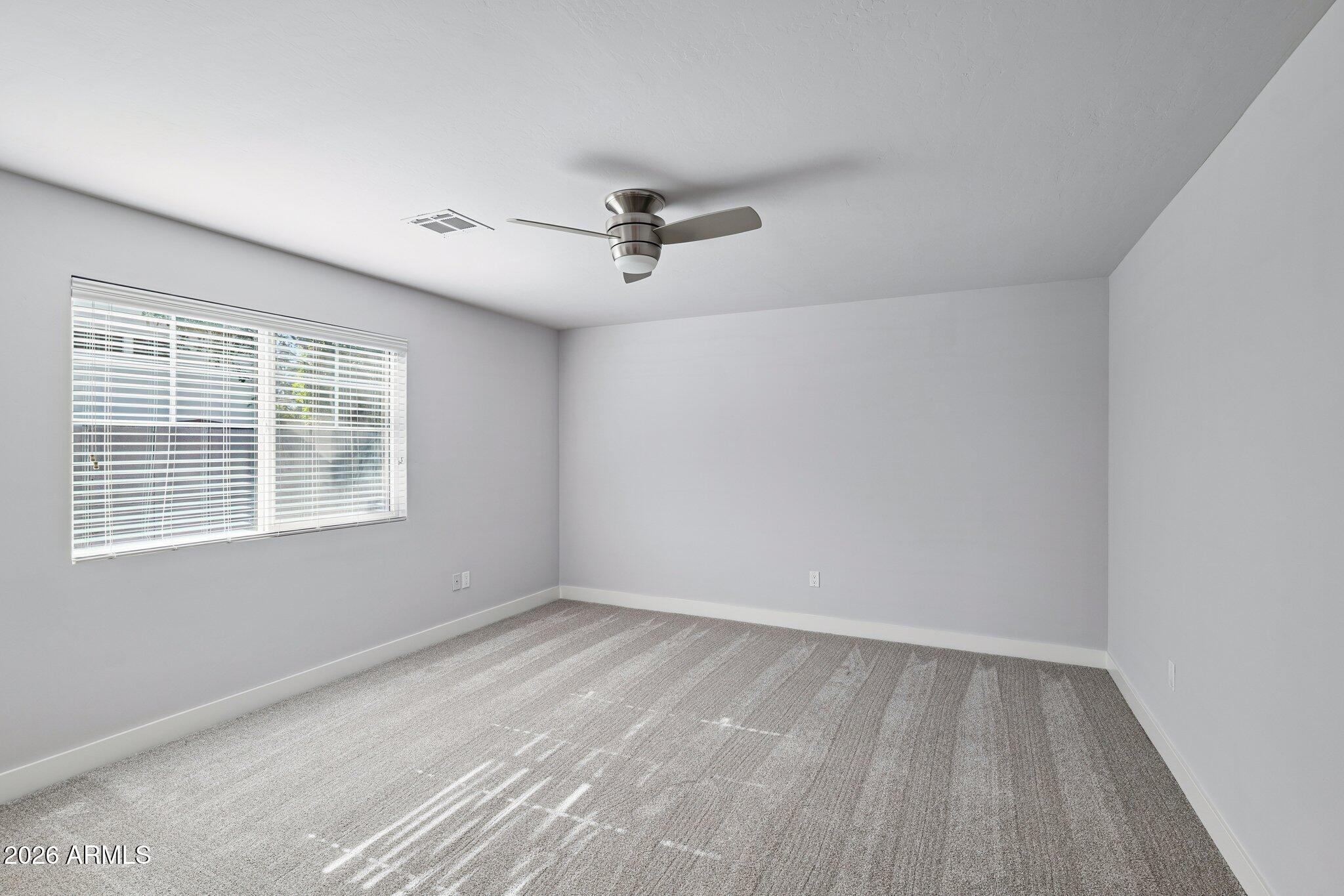 4232 North 19th Place Phoenix, AZ 85016 - Photo 18 of 39 wooden floor in an empty room with a window