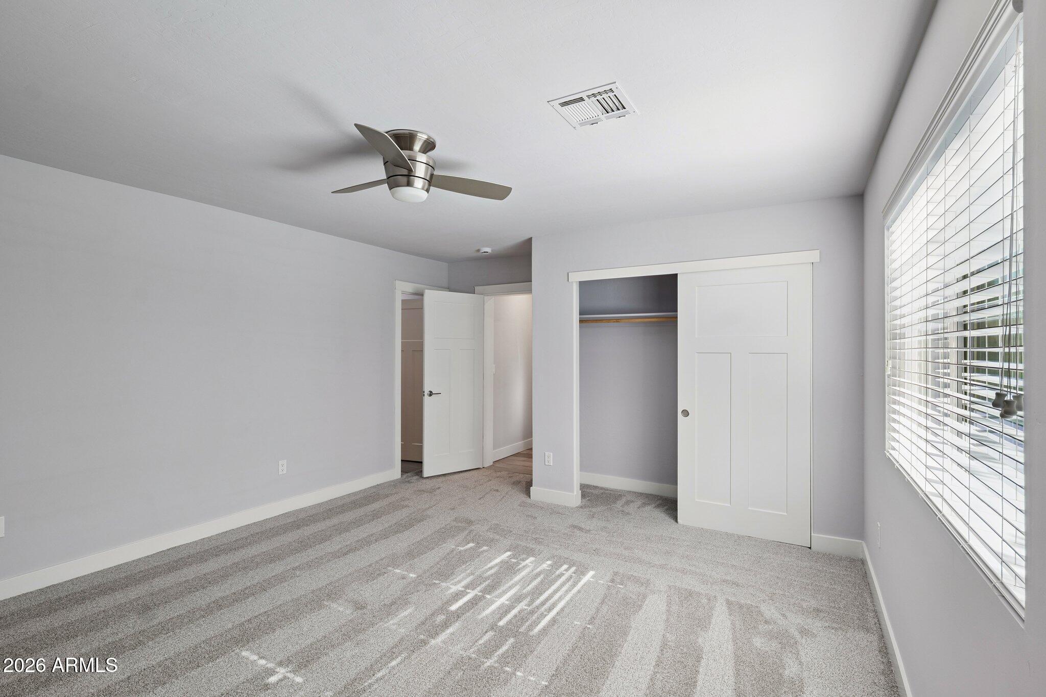 4232 North 19th Place Phoenix, AZ 85016 - Photo 19 of 39 a view of a livingroom with a ceiling fan and window