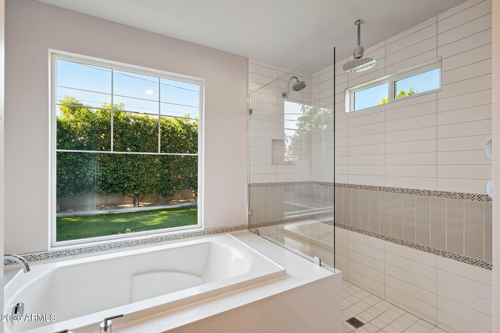 4232 North 19th Place Phoenix, AZ 85016 - Photo 22 of 39 a bathroom with a bathtub and a shower