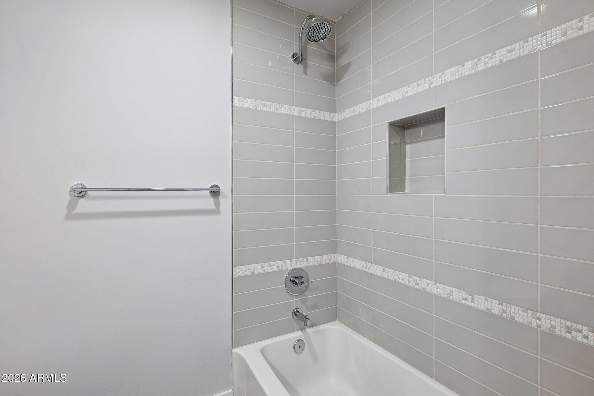 4232 North 19th Place Phoenix, AZ 85016 - Photo 27 of 39 a bathroom with a white bath tub and a shower