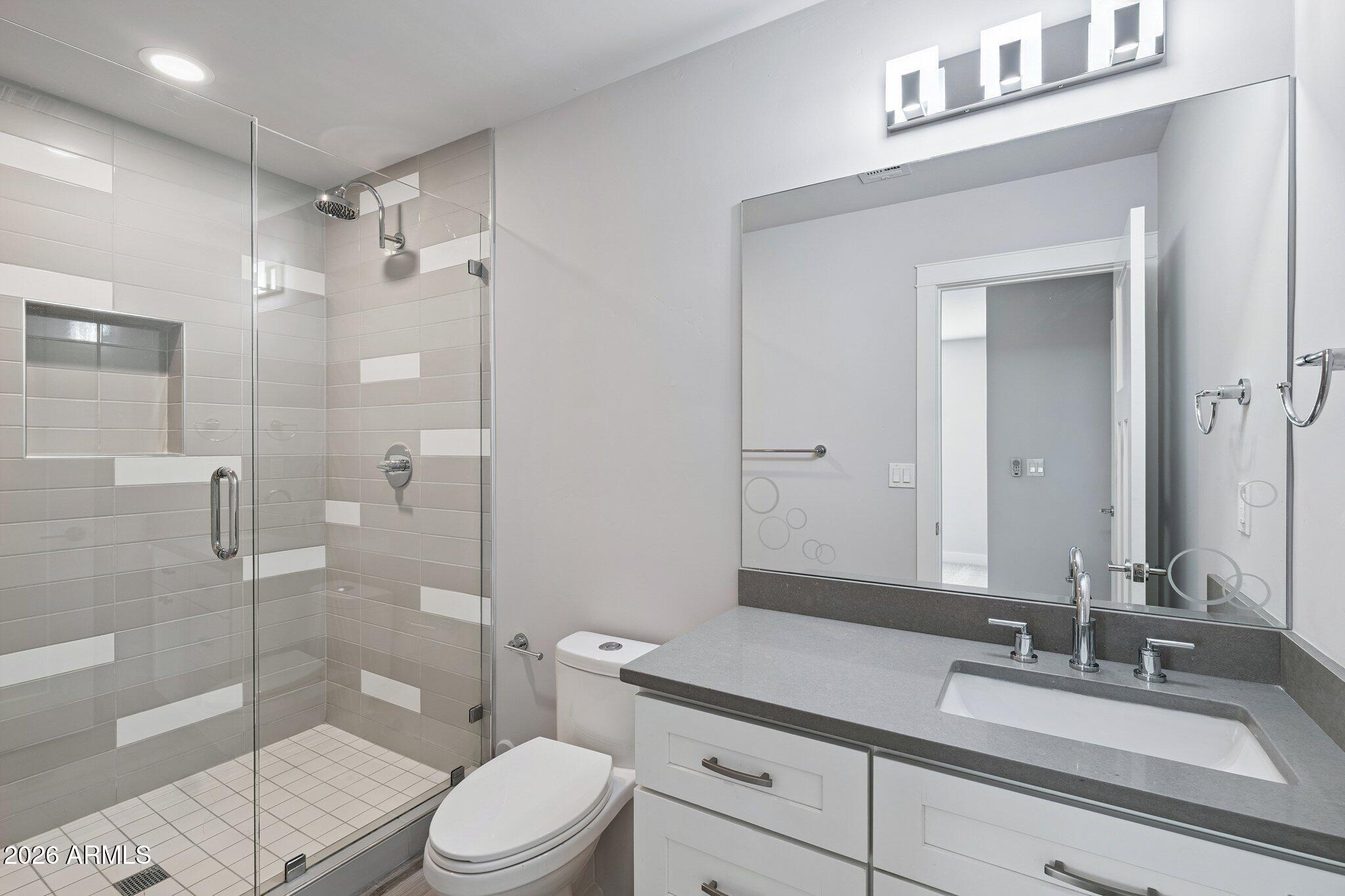 4232 North 19th Place Phoenix, AZ 85016 - Photo 28 of 39 a bathroom with a sink a toilet and shower