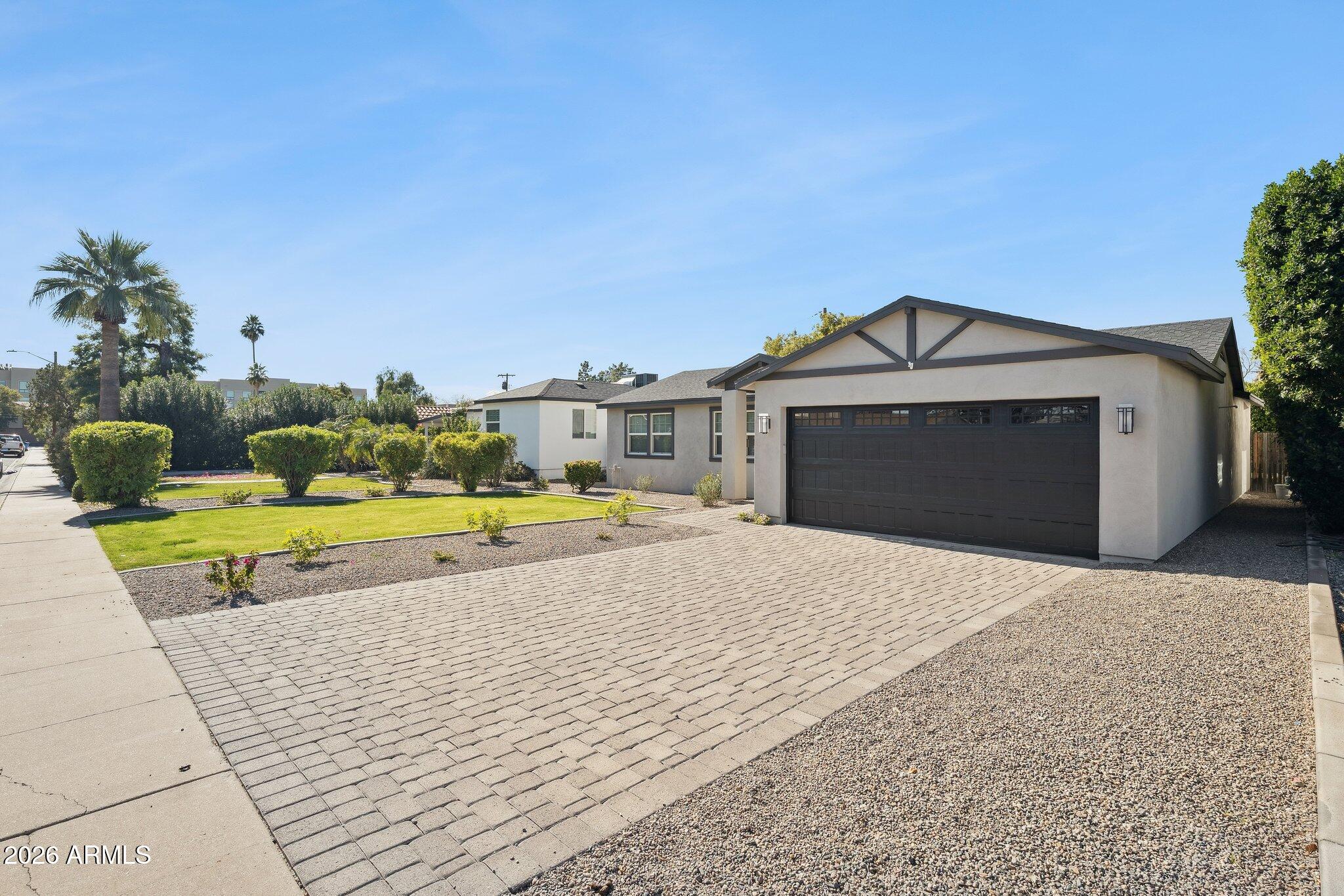 4232 North 19th Place Phoenix, AZ 85016 - Photo 2 of 39 a view of a house with a yard and potted plants