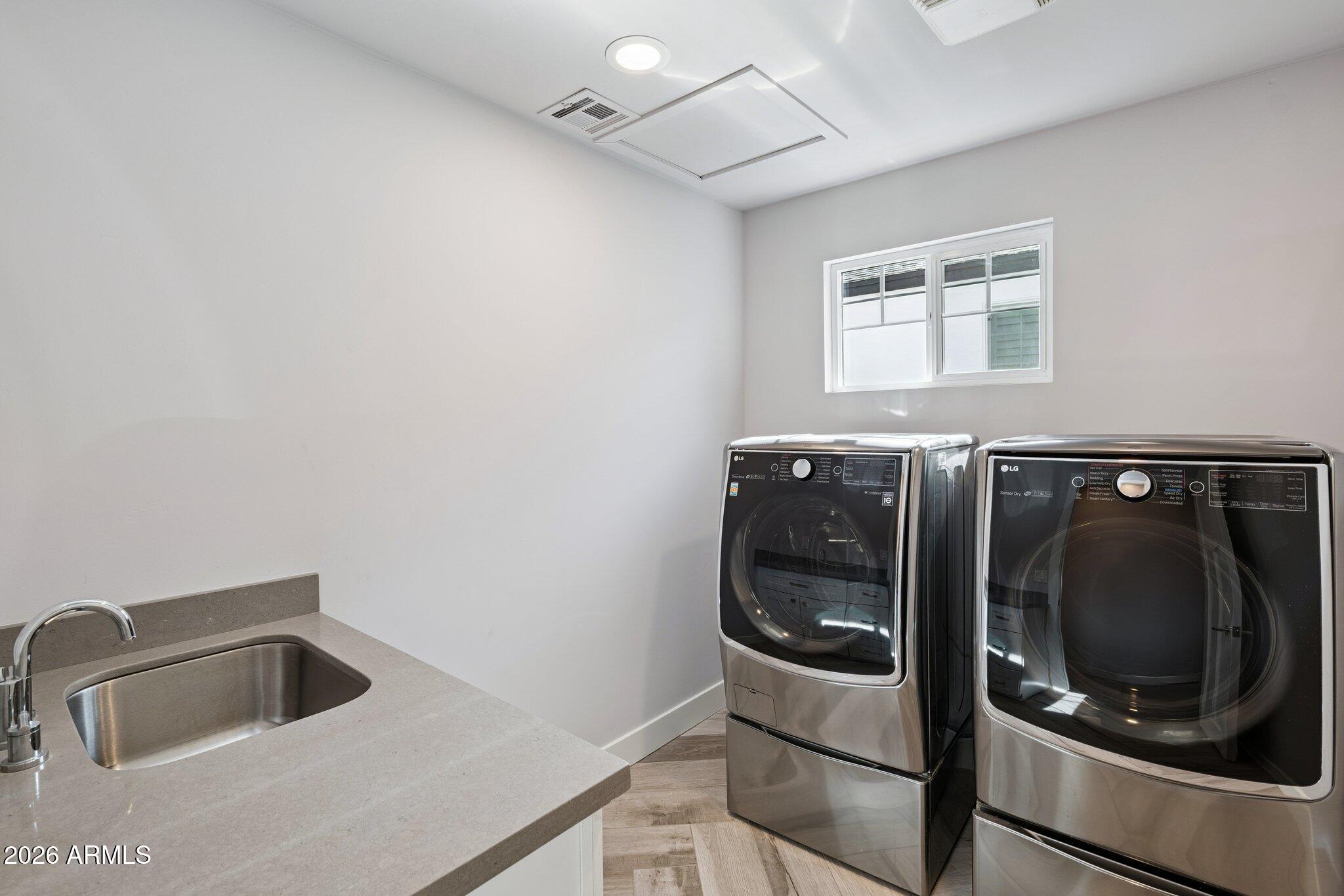 4232 North 19th Place Phoenix, AZ 85016 - Photo 33 of 39 a close view of a sink and a refrigerator in a kitchen