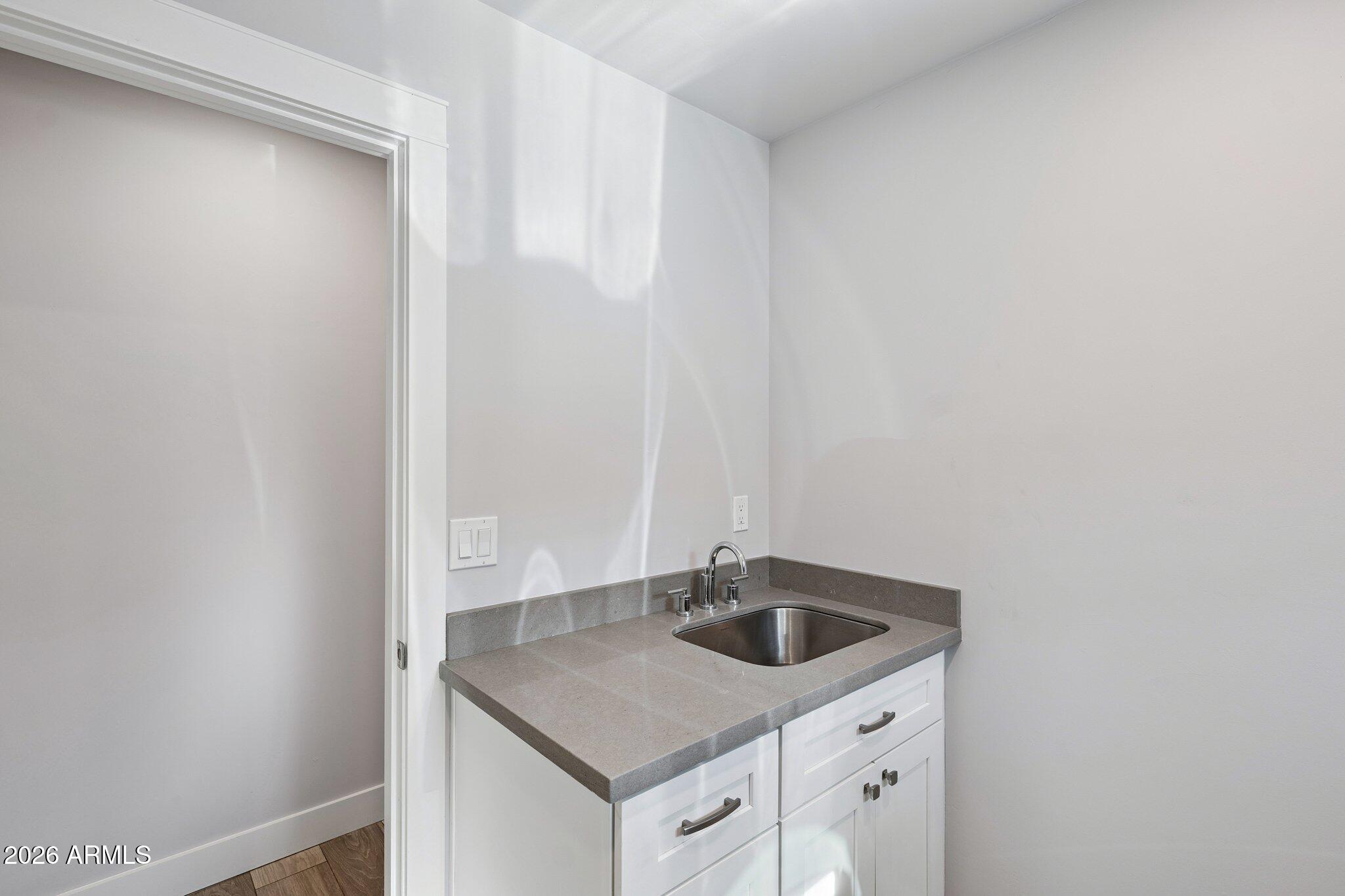 4232 North 19th Place Phoenix, AZ 85016 - Photo 34 of 39 a kitchen with a sink and cabinets