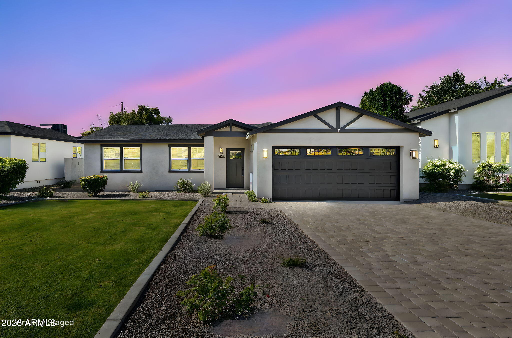 4232 North 19th Place Phoenix, AZ 85016 - Photo 3 of 39 a front view of a house with a yard and garage