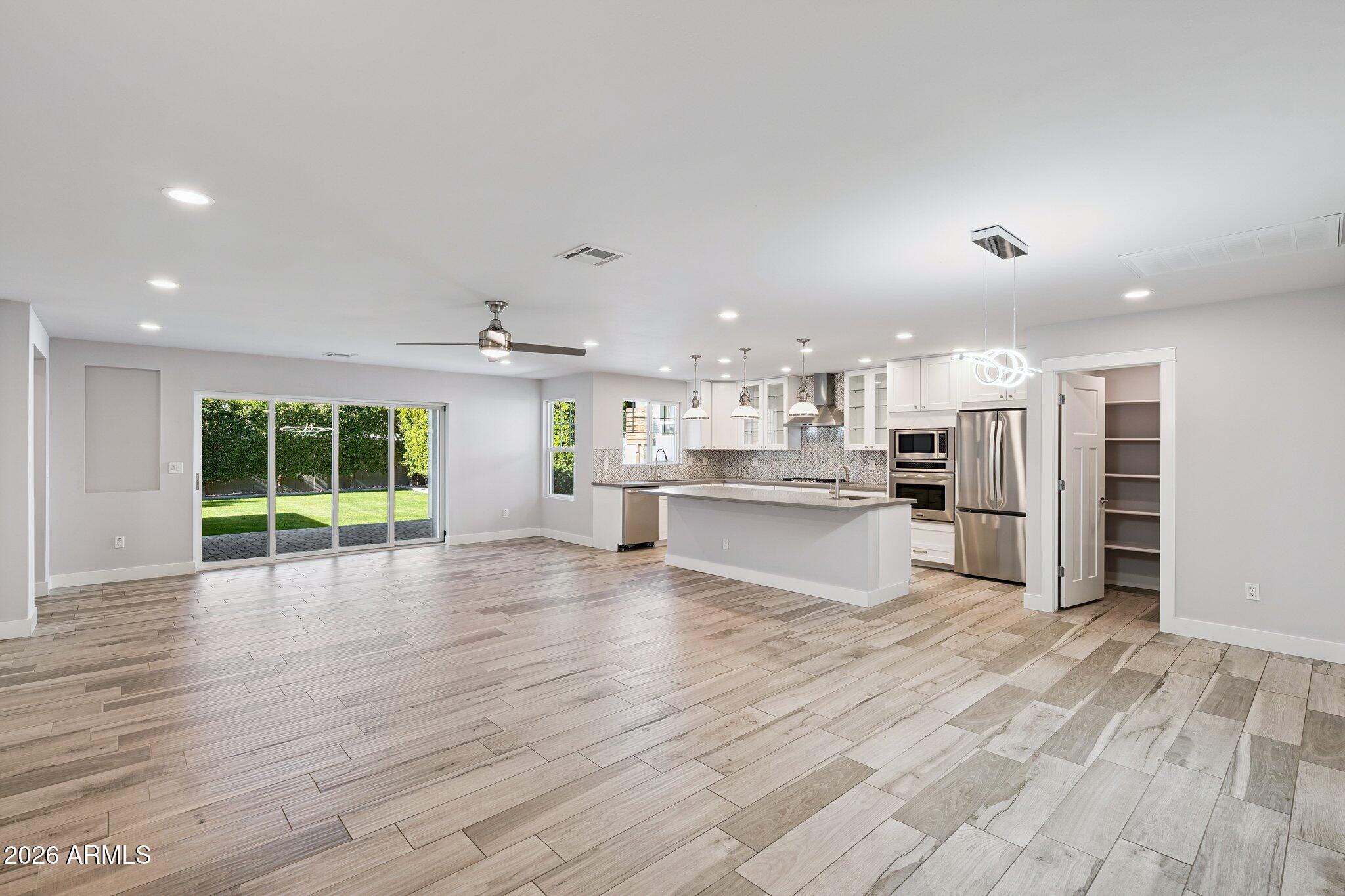4232 North 19th Place Phoenix, AZ 85016 - Photo 7 of 39 a view of kitchen with furniture and wooden floor