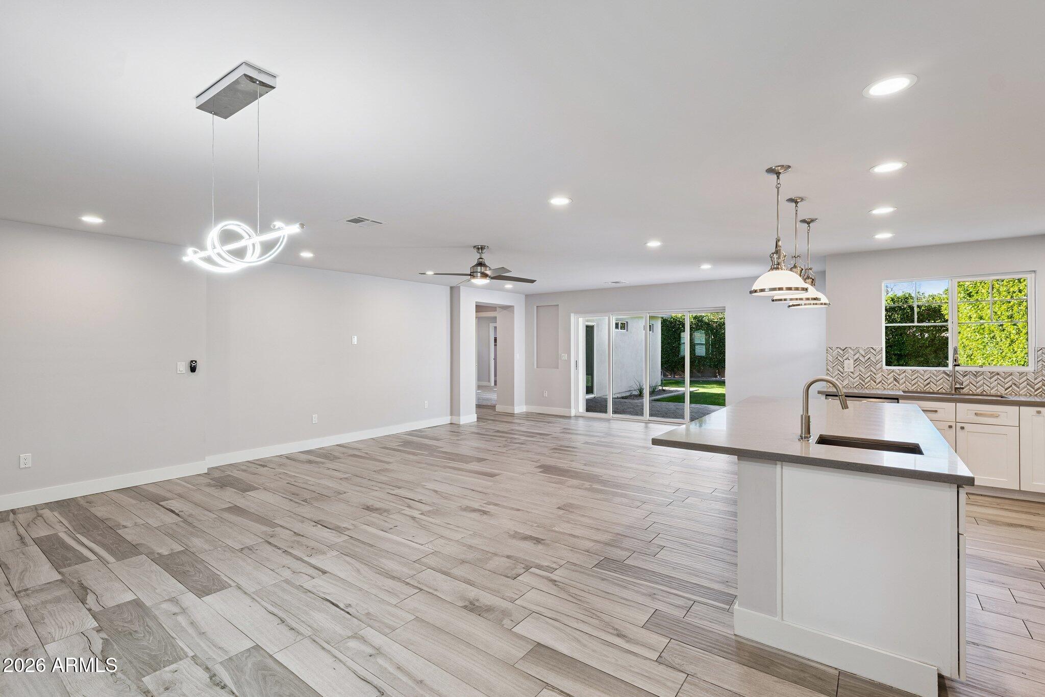 4232 North 19th Place Phoenix, AZ 85016 - Photo 9 of 39 a view of a kitchen with granite countertop natural light