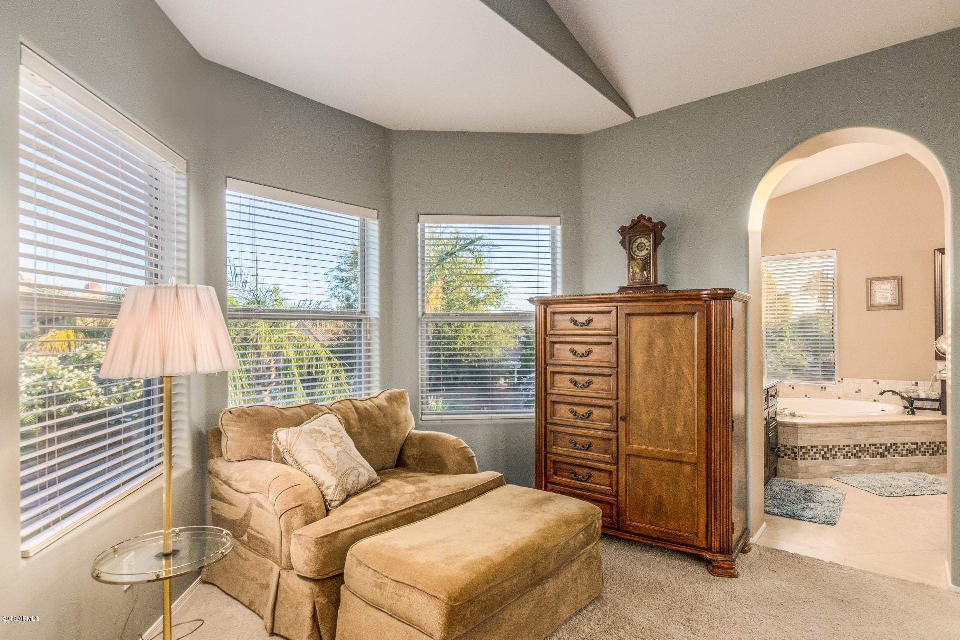6015 East Phelps Road Scottsdale, AZ 85254 - Photo 28 of 72 a living room with furniture and a window