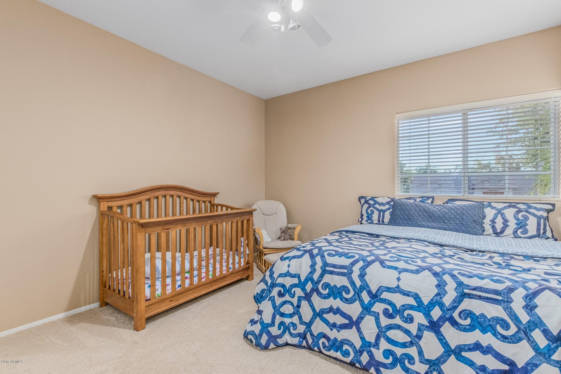 6015 East Phelps Road Scottsdale, AZ 85254 - Photo 35 of 72 a bedroom with a bed and a window