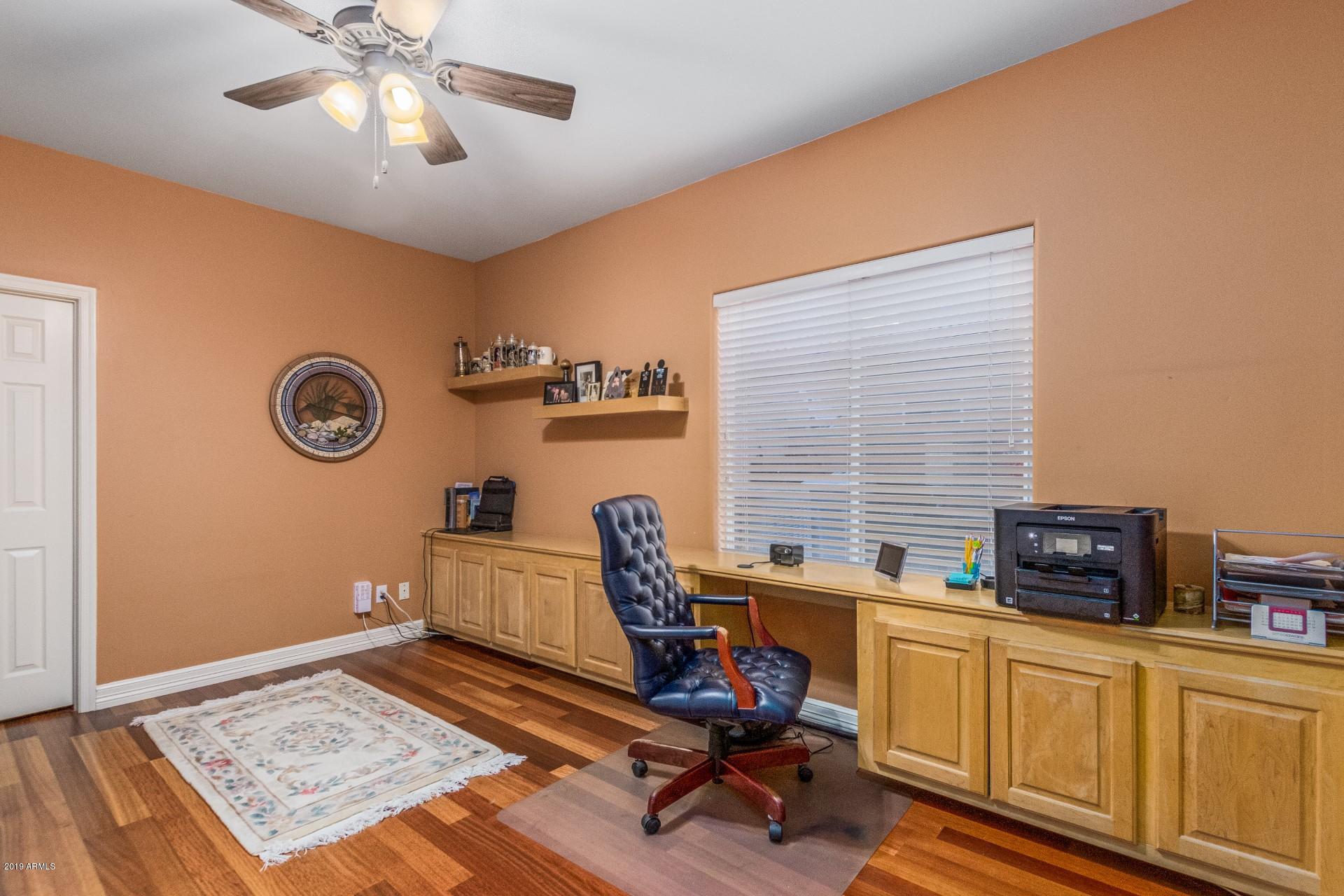 6015 East Phelps Road Scottsdale, AZ 85254 - Photo 42 of 72 a view of a workspace with furniture and a window