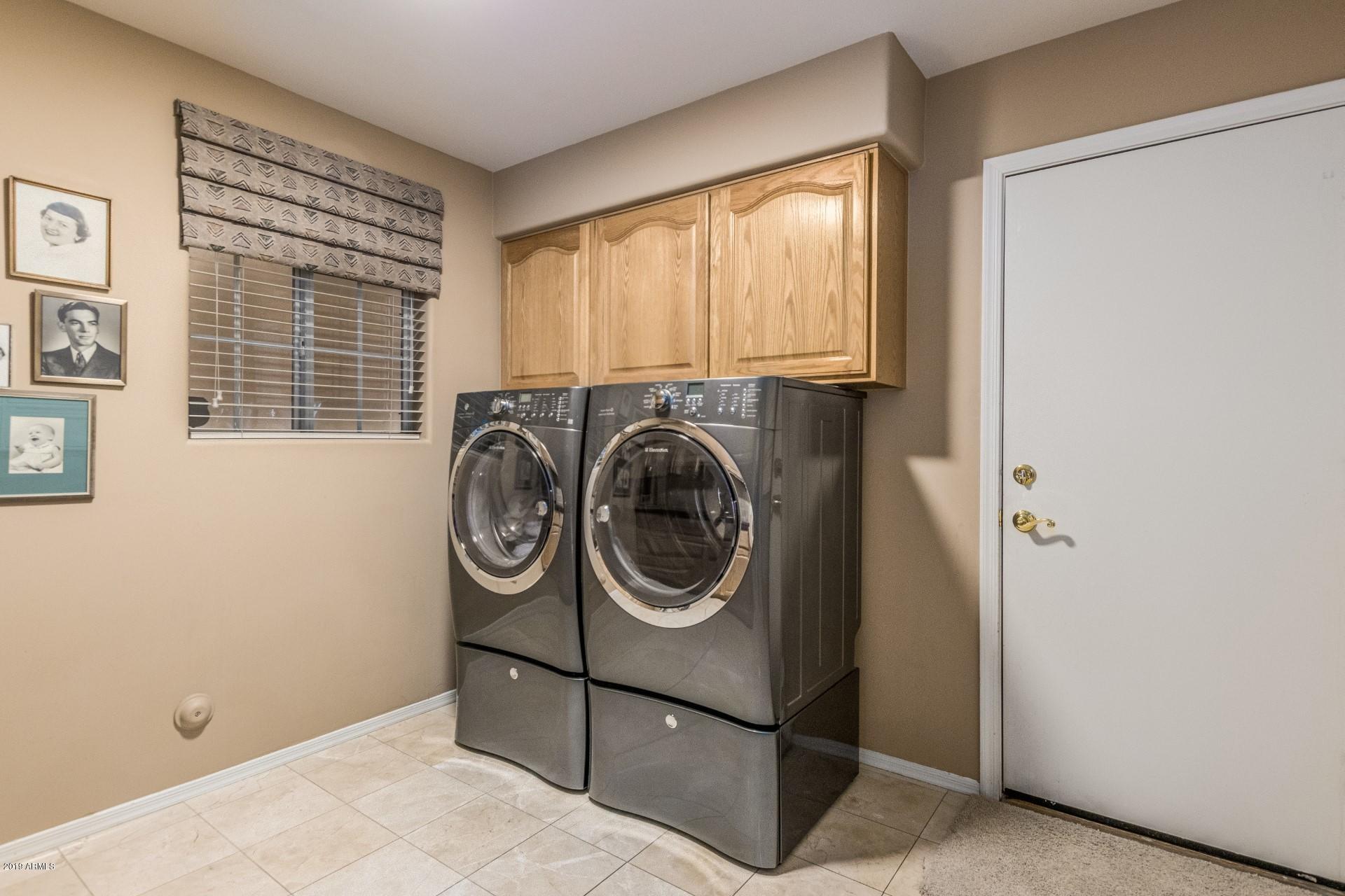 6015 East Phelps Road Scottsdale, AZ 85254 - Photo 43 of 72 a utility room with dryer and washer