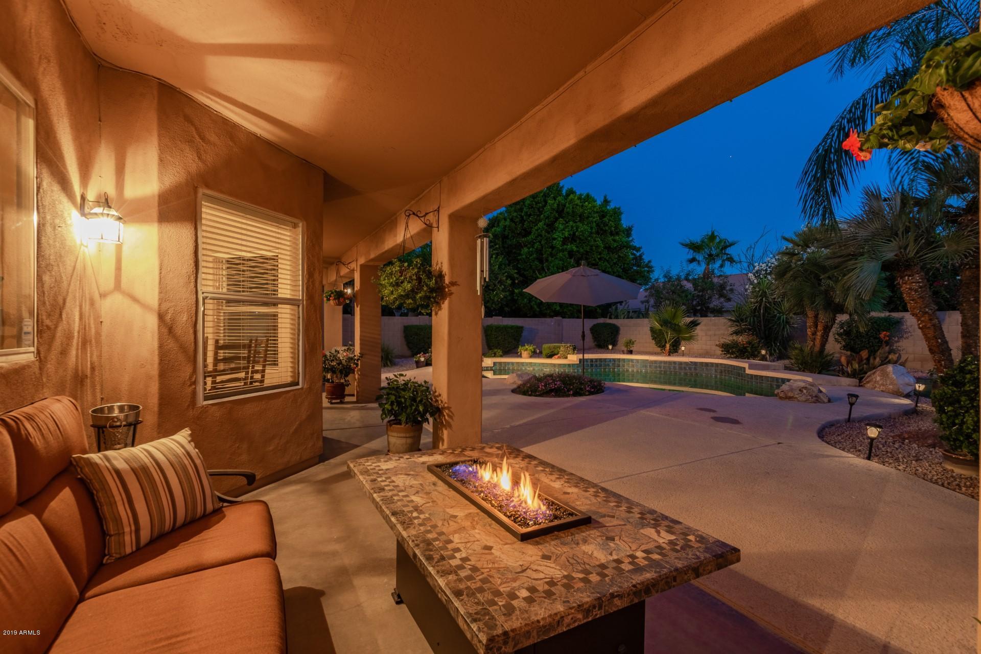 6015 East Phelps Road Scottsdale, AZ 85254 - Photo 58 of 72 a living room with furniture and a couch