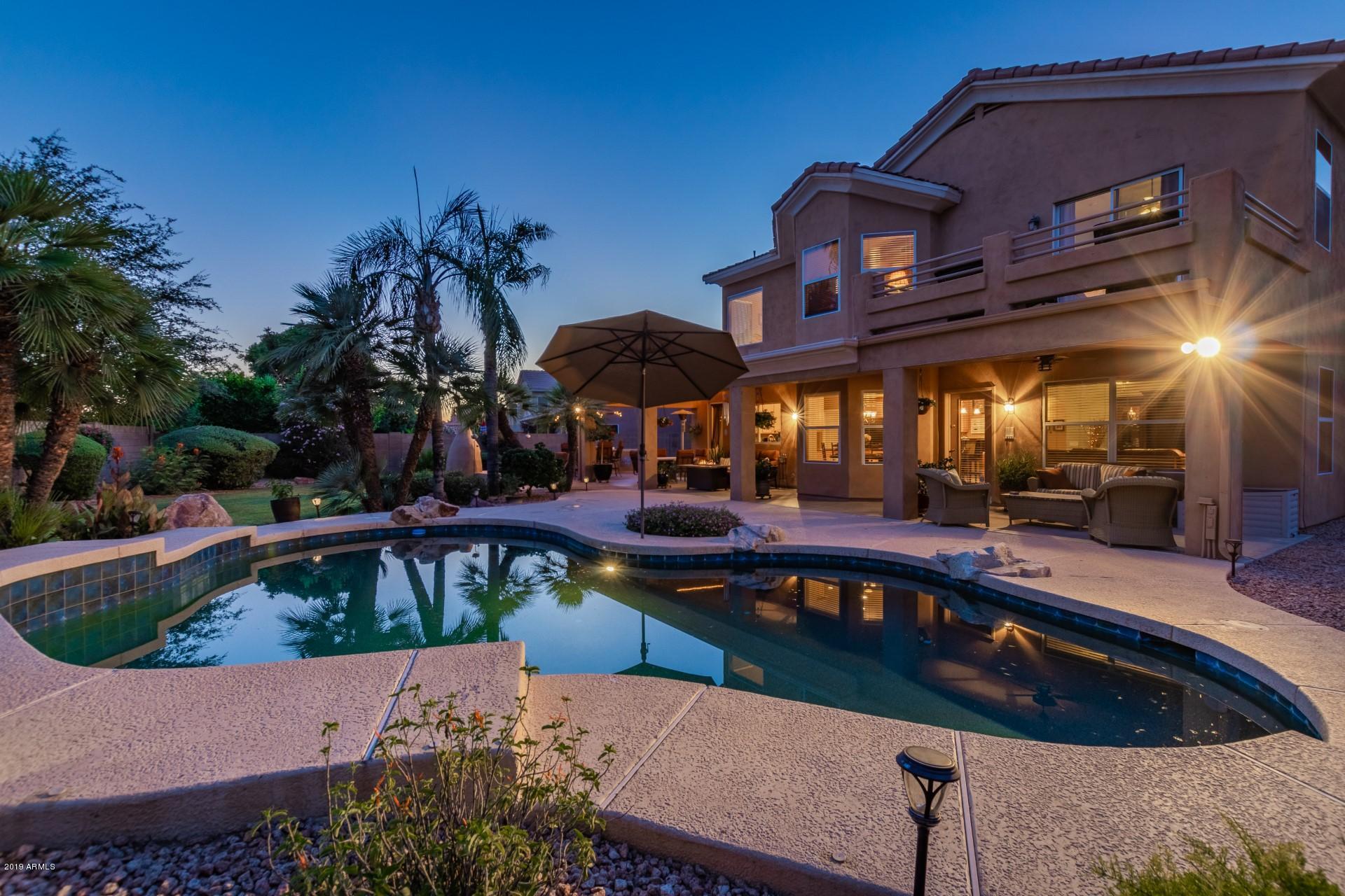 6015 East Phelps Road Scottsdale, AZ 85254 - Photo 63 of 72 a view of a chairs and table in the patio