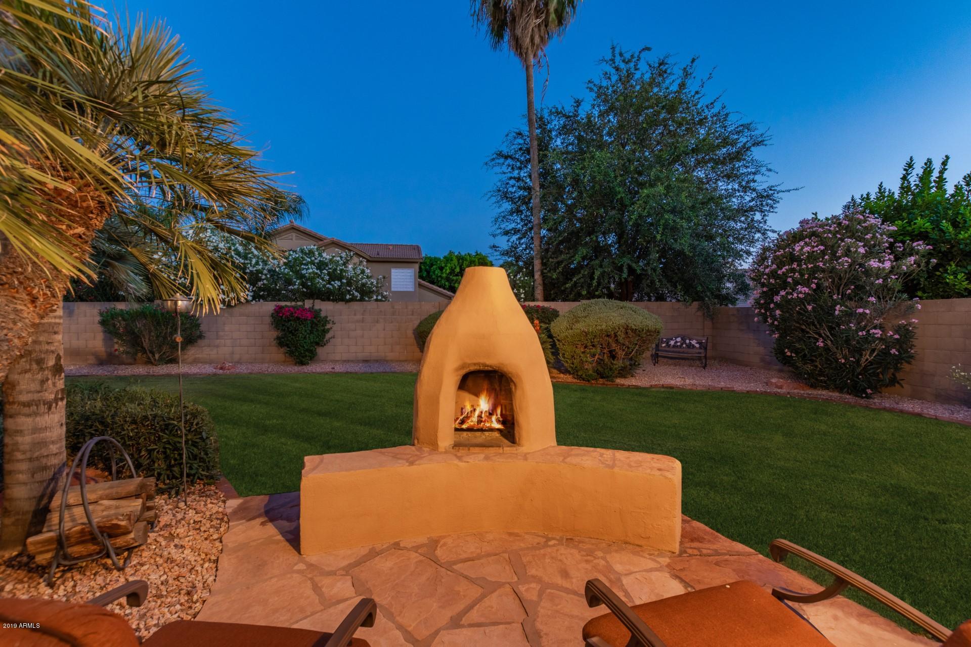 6015 East Phelps Road Scottsdale, AZ 85254 - Photo 66 of 72 Night Fireplace