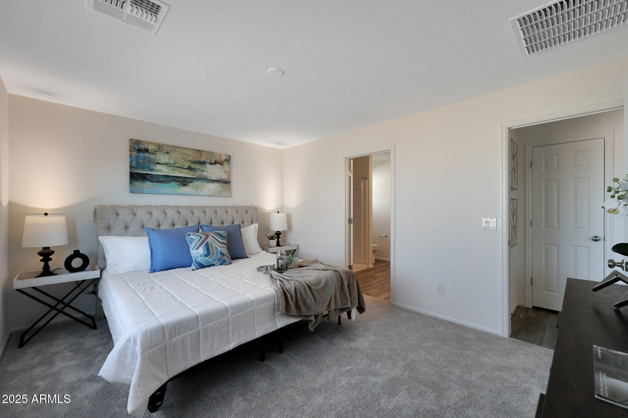 1319 West Aztec Drive Coolidge, AZ 85128 - Photo 8 of 18 a bedroom with a bed and a chair