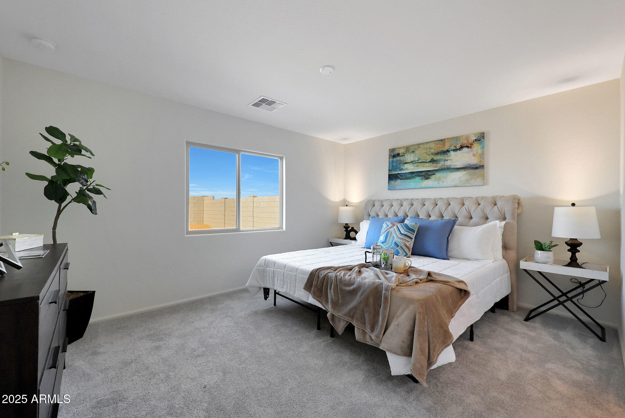 1319 West Aztec Drive Coolidge, AZ 85128 - Photo 9 of 18 a bedroom with bed and a potted plant