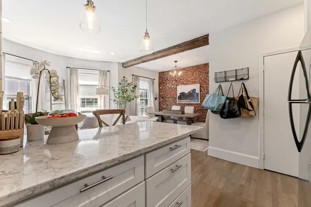 a kitchen with sink refrigerator and window