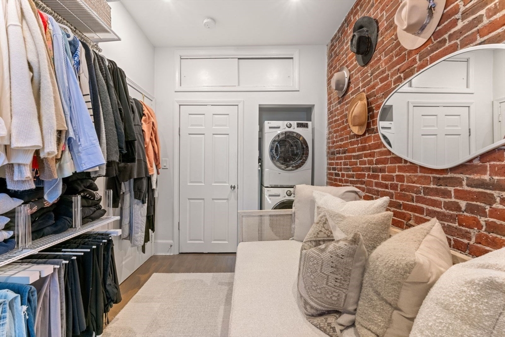 91 Waltham Street, Unit 4 Boston, MA 02118 - Photo 18 of 26 a view of walk in closet with clothes and shoes