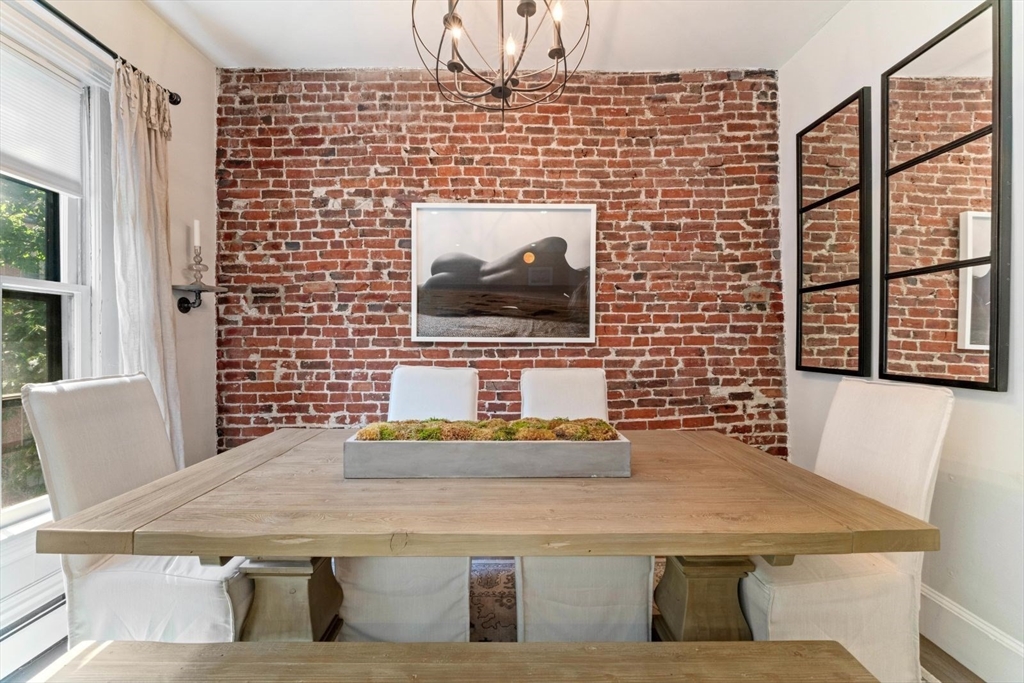 91 Waltham Street, Unit 4 Boston, MA 02118 - Photo 5 of 26 a dining room with table and chairs