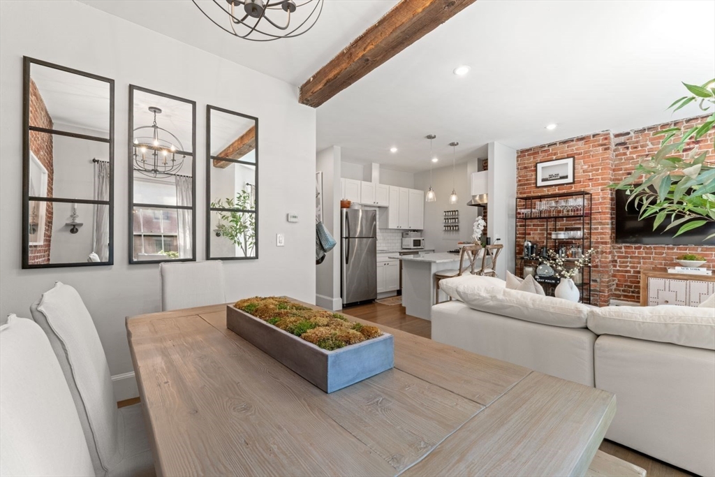 91 Waltham Street, Unit 4 Boston, MA 02118 - Photo 7 of 26 a living room with furniture and a flat screen tv