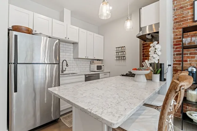 a kitchen with refrigerator and countertop