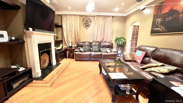 a living room with furniture fireplace and flat screen tv