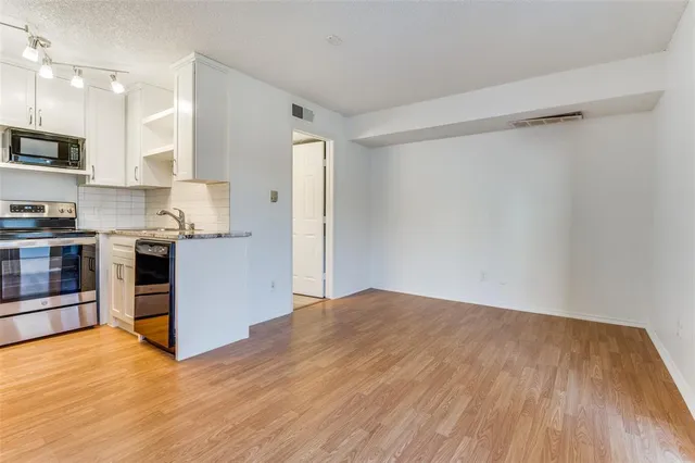 a view of kitchen with wooden floor