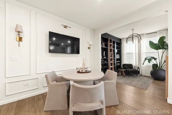 a dining room with furniture and window