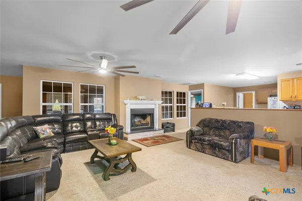 a living room with furniture fireplace and flat screen tv