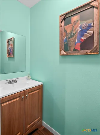 a room with a painting on the wall and a shower