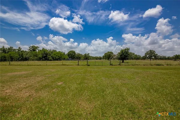 a view of a golf course with a lake