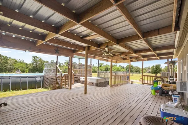 a view of a hall with wooden floor