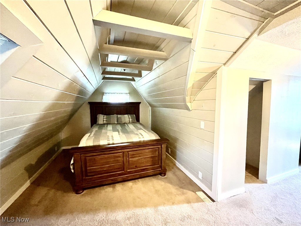 4440 Dryden Court Southwest Canton, OH 44708 - Photo 28 of 28 Stairs with carpet floors and vaulted ceiling