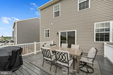 a view of a patio with a table and chairs