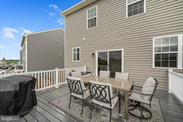 a view of a patio with a table and chairs