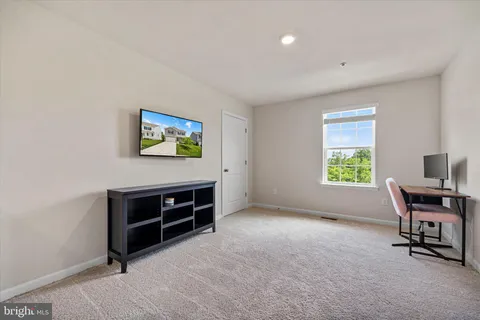 a workspace with furniture and window