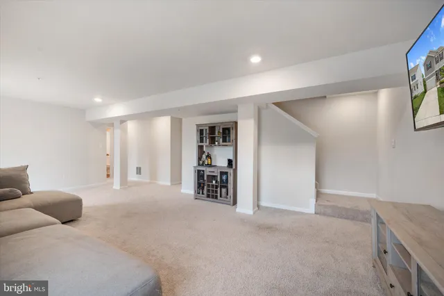 a large bedroom with a bed and a walk in closet