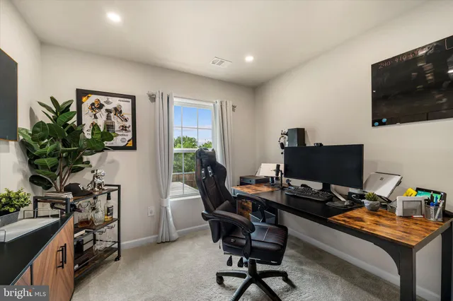 a workspace with furniture and wooden floor