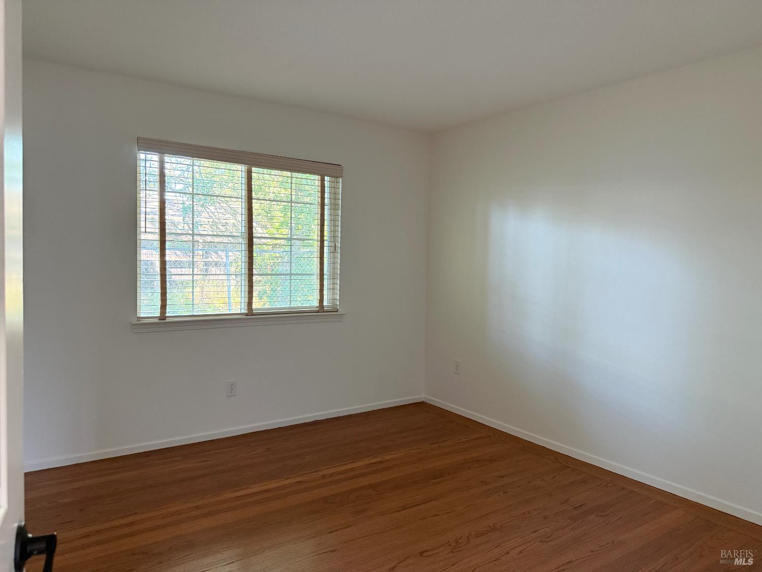 2553 Cactus Avenue Santa Rosa, CA 95405 - Photo 7 of 15 wooden floor in an empty room with a window
