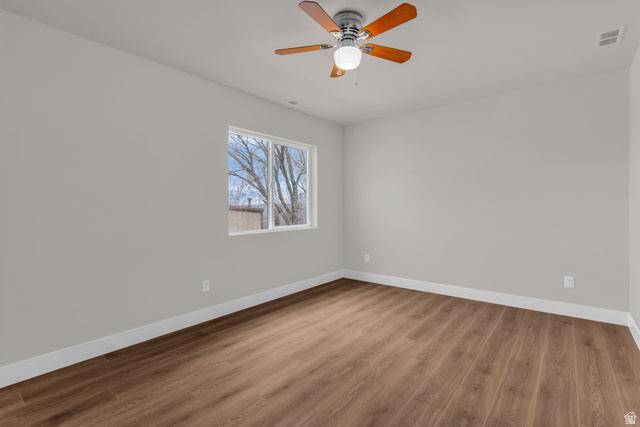 576 7th Avenue Midvale, UT 84047 - Photo 11 of 32 Unfurnished room featuring wood finished floors and a ceiling fan