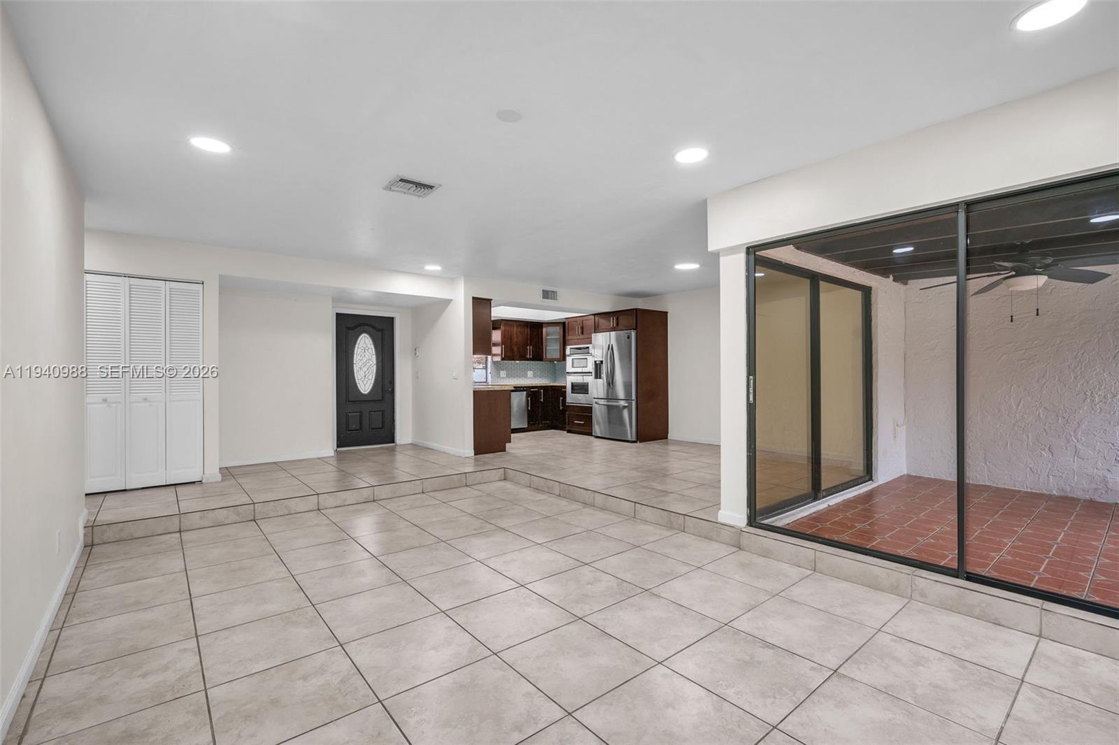 11125 Southwest 134th Court Miami, FL 33186 - Photo 11 of 33 a view of empty room with wooden floor